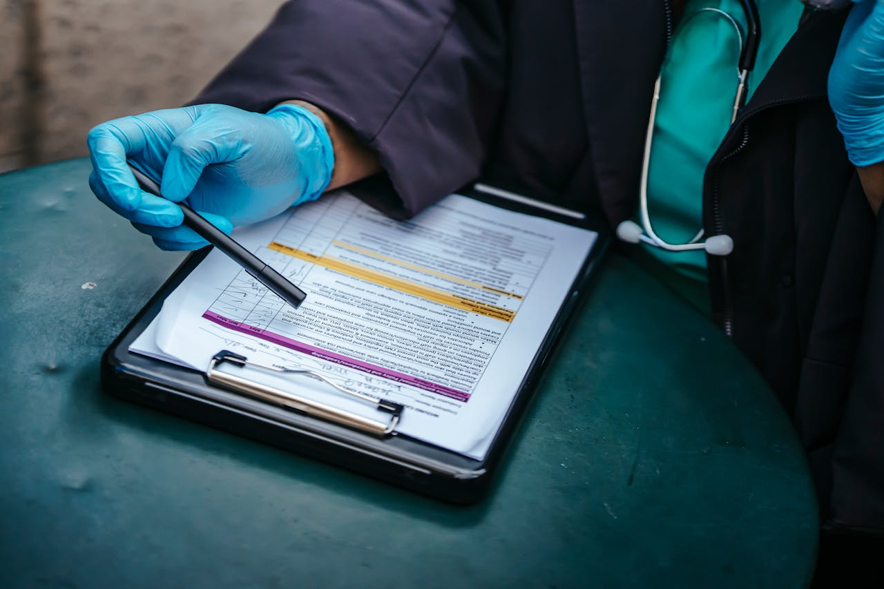 The Art of Drawing Readers In: Your attractive post title goes here From above of crop anonymous plump female doctor in disposable gloves working at table with paper on clipboard